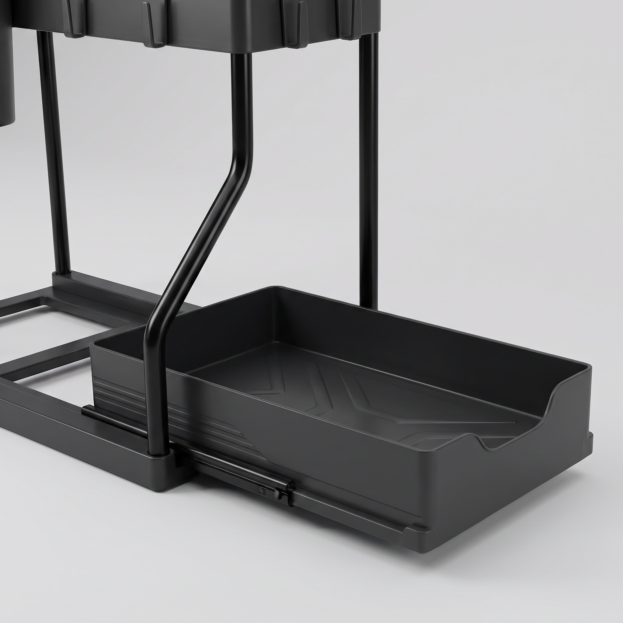 Close-up of the sliding bottom drawer on the two-tier under-sink organizer