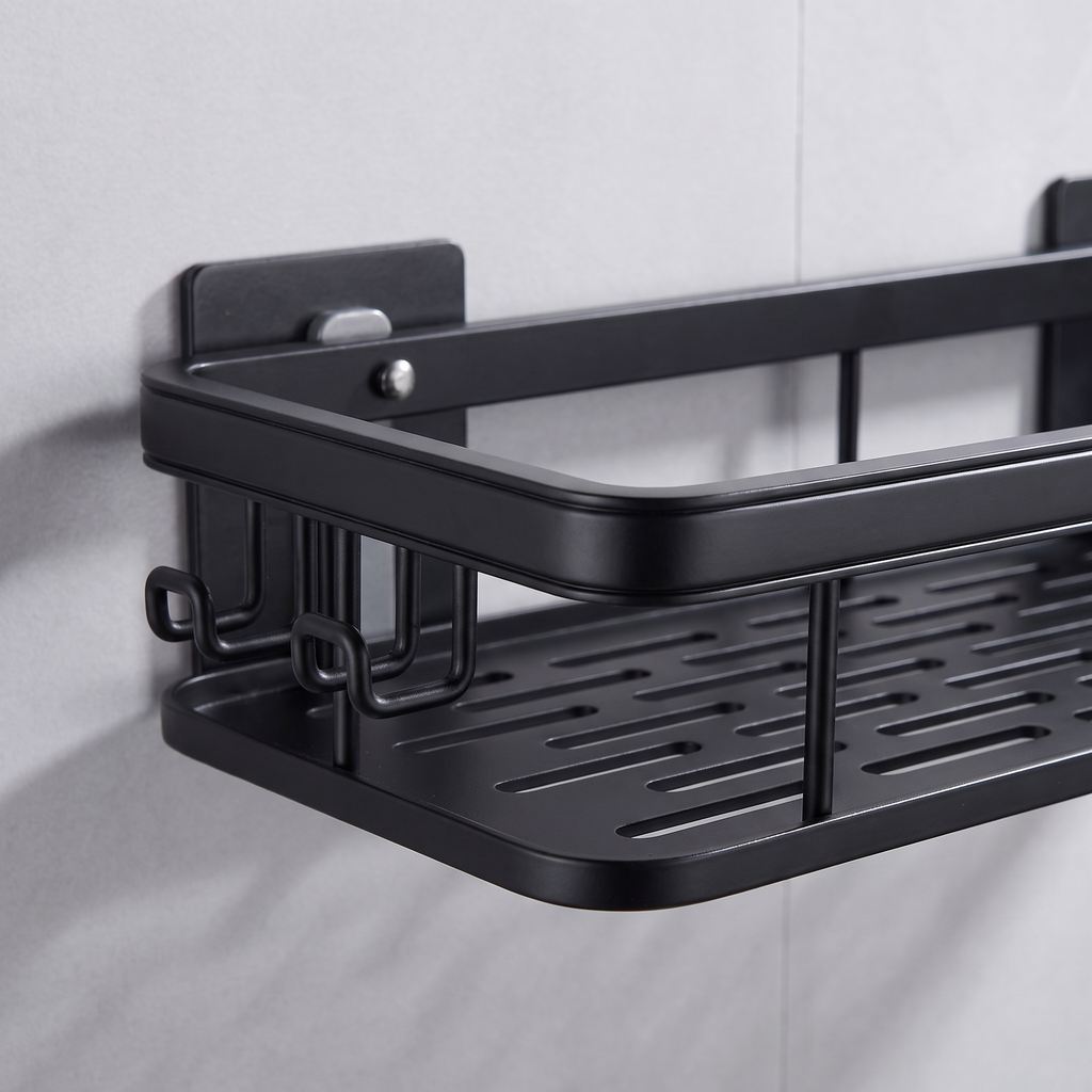 Close-up of the adhesive mounting plate and the three side hooks on the left end of the black bathroom shelf