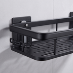 Close-up of the adhesive mounting plate and the three side hooks on the left end of the black bathroom shelf