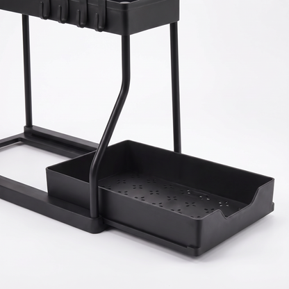 Close-up of the shallow slide-out bottom tray with drainage slots on the two-tier under-sink organizer