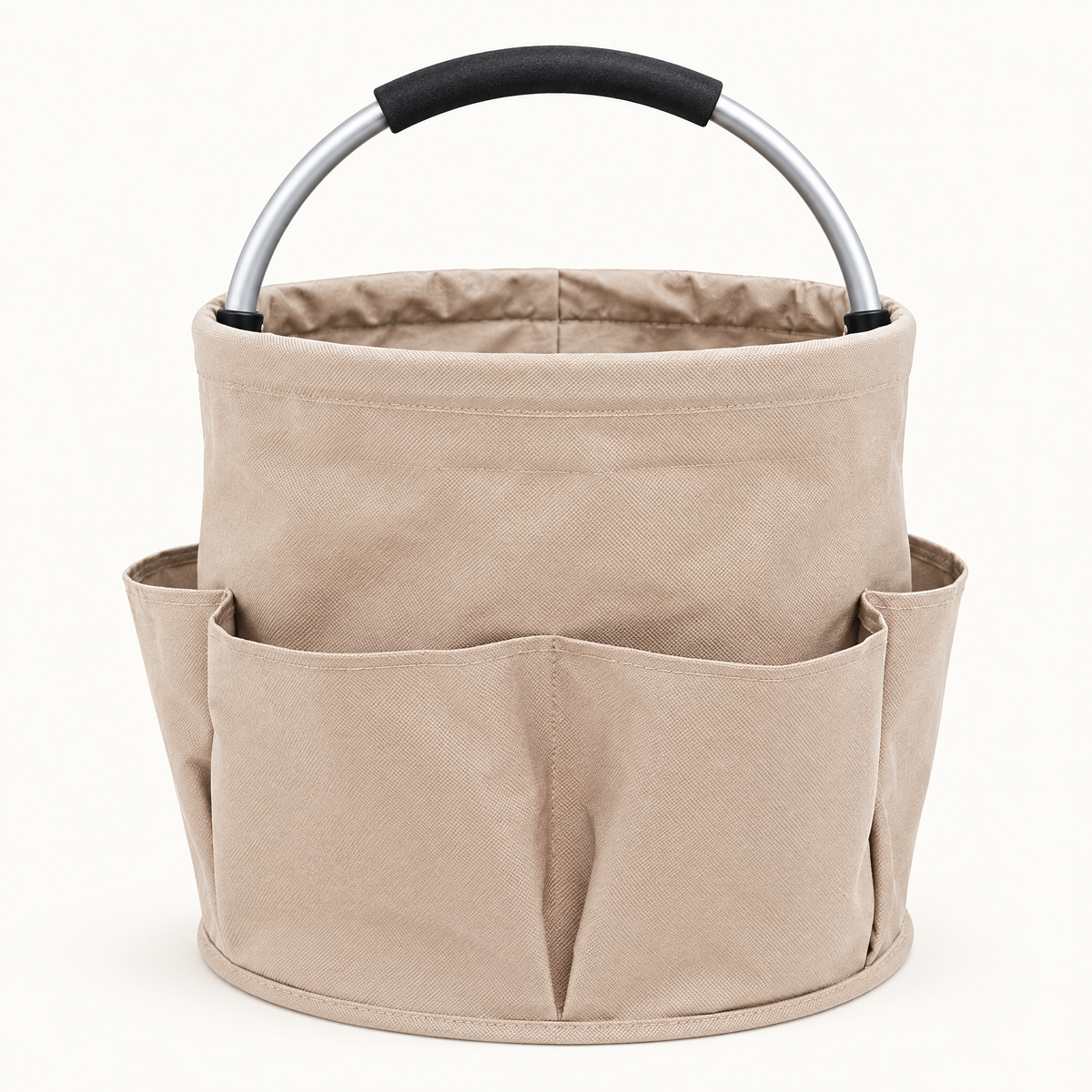 Empty beige round fabric cleaning caddy with exterior pockets and an arched aluminum handle on a light background