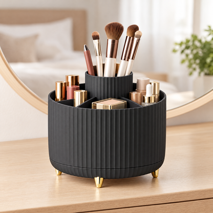 Black rotating makeup organizer on a dressing table holding makeup brushes and cosmetics in front of a round mirror