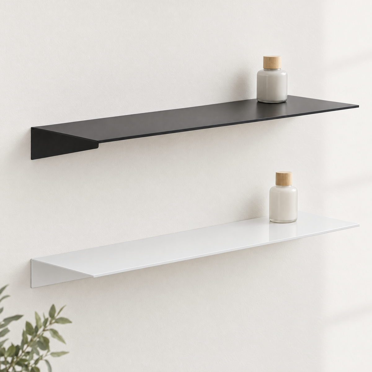 Black and white floating shelves mounted one above the other on a light wall