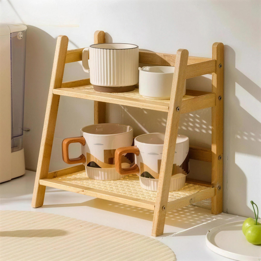 Natural bamboo two-tier countertop organizer shelf holding mugs on a kitchen counter
